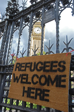 Doormat reading Refugees Welcome Here